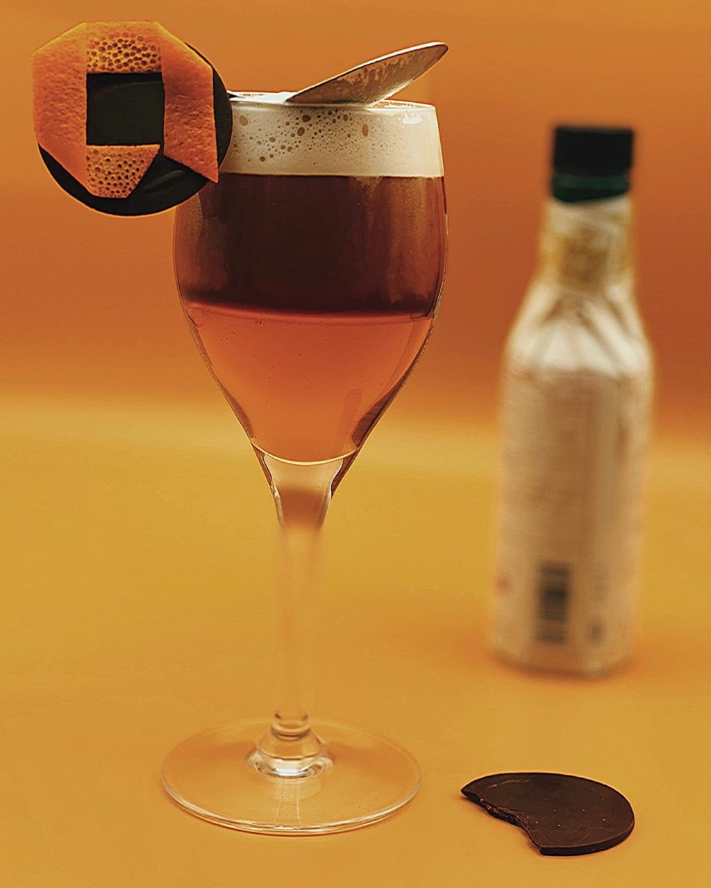 ABC Salles -  Café-calva revisité dans un verre à pied et décoré avec le logo d'ABC Salles fait en zeste d'orange.
