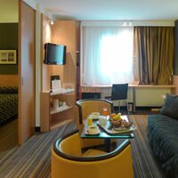 Suite espace salon et couchage king size